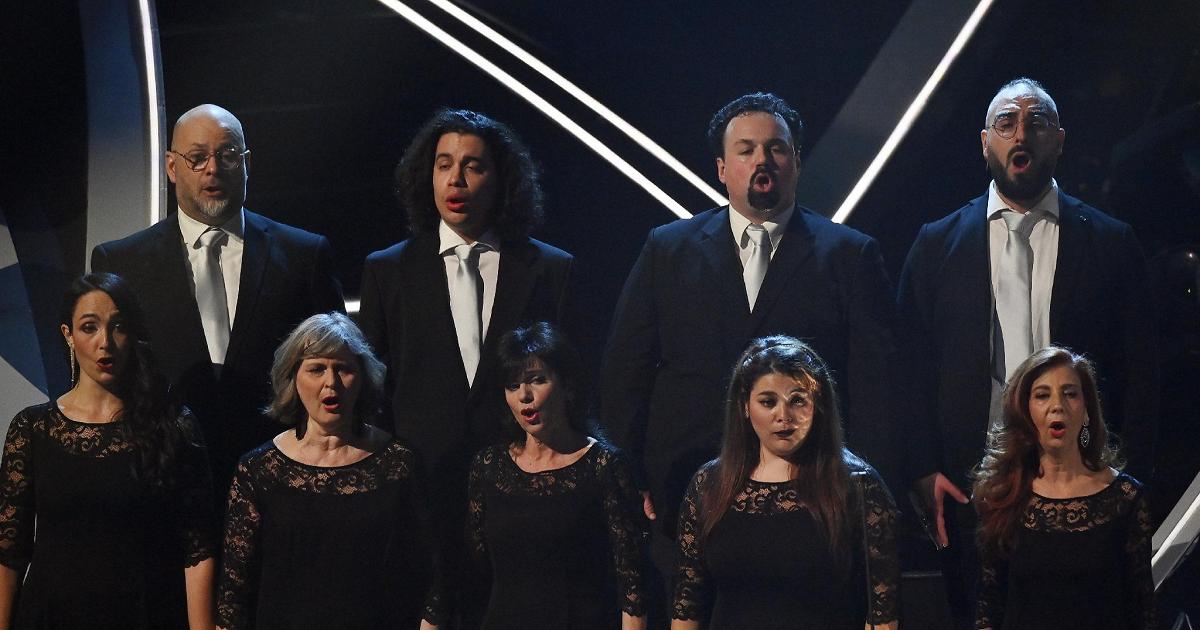 the Arena di Verona Foundation Choir sings “Va Pensiero” at the Ariston